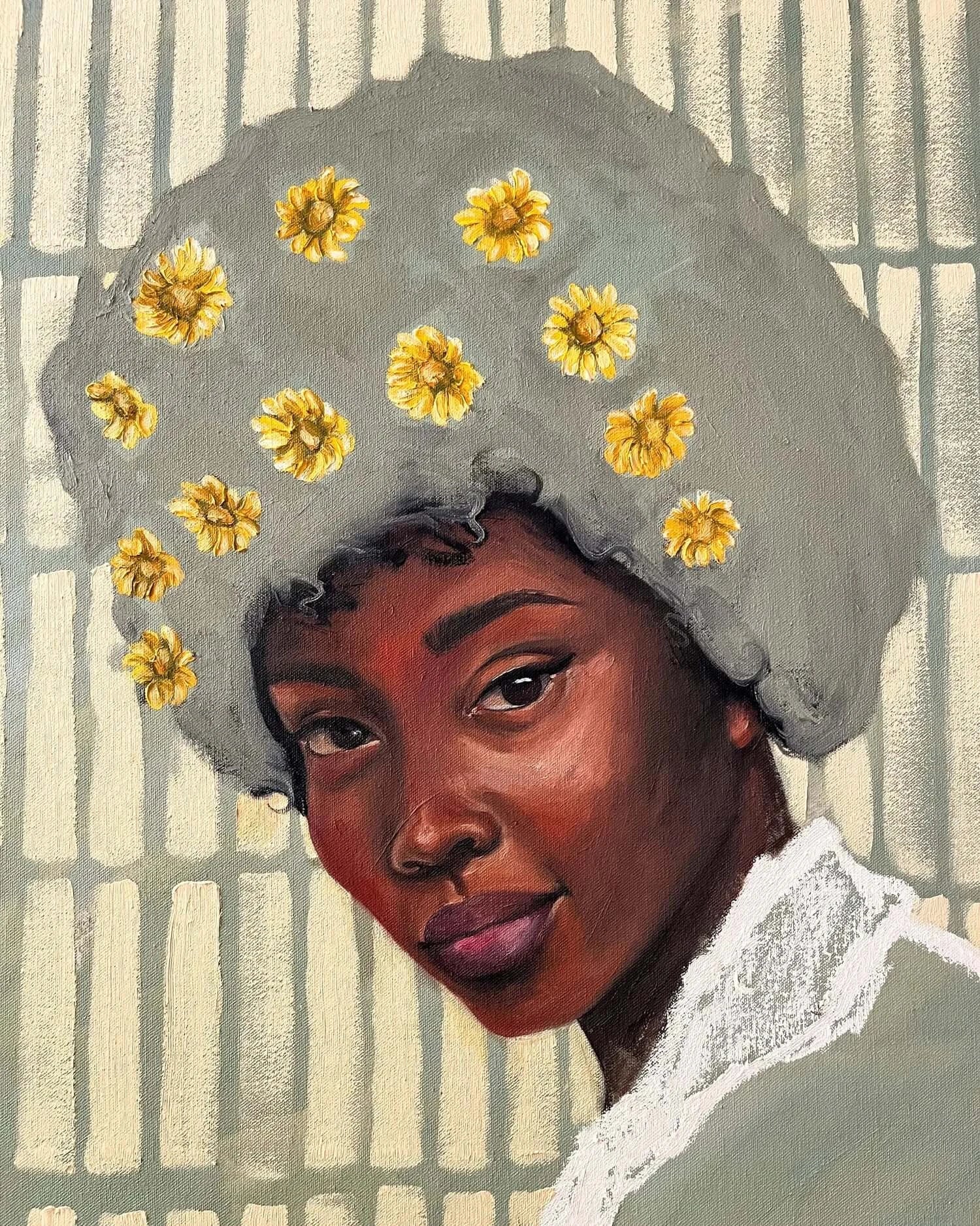 Portrait of a Black woman with daisies in her hair, embodying Zahara's essence of motherhood and resilience.