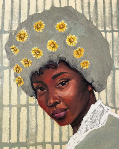 Portrait of a Black woman with daisies in her hair, embodying Zahara's essence of motherhood and resilience.